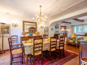 a dining room with a table and chairs at Holiday Home L'Oliverede by Interhome in La Garde-Freinet +26 photos