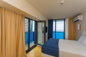Postel nebo postele na pokoji v ubytování Orbi City Hotel Official D Block