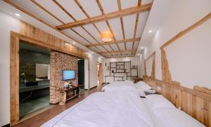 Hongfu Villa - Zhangjiajie National Forest Park West Gate客房内的一张或多张床位