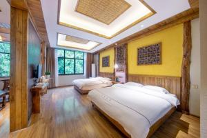 Hongfu Villa - Zhangjiajie National Forest Park West Gate客房内的一张或多张床位