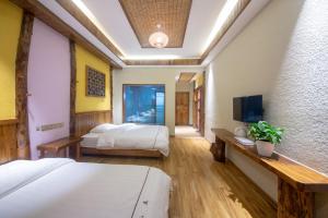 Hongfu Villa - Zhangjiajie National Forest Park West Gate客房内的一张或多张床位