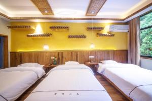 Hongfu Villa - Zhangjiajie National Forest Park West Gate客房内的一张或多张床位