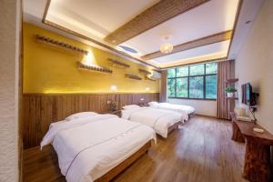 Hongfu Villa - Zhangjiajie National Forest Park West Gate客房内的一张或多张床位