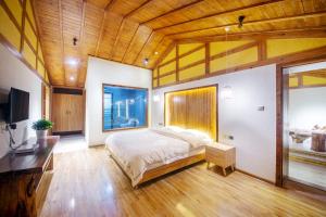 Hongfu Villa - Zhangjiajie National Forest Park West Gate客房内的一张或多张床位
