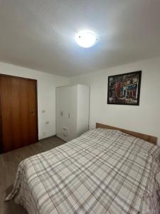 Postel nebo postele na pokoji v ubytování Kuky's Val di Sole Retreat