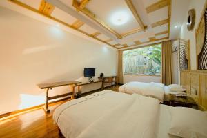Hongfu Villa - Zhangjiajie National Forest Park West Gate客房内的一张或多张床位