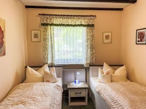 Ένα ή περισσότερα κρεβάτια σε δωμάτιο στο Apartment Am Hohen Bogen-25 by Interhome