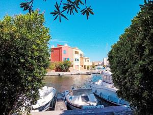 a group of boats are docked in a marina at Holiday Home Nautica-3 by Interhome in Le Barcarès