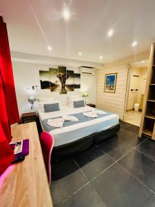 Postel nebo postele na pokoji v ubytování Hôtel Coco Island