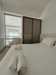 Postel nebo postele na pokoji v ubytování Possidi Hiliadou Boutique Resort