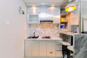 Gallery image of Homey and Minimalist 1BR Royal Sentul Park Apartment By Travelio in Bogor