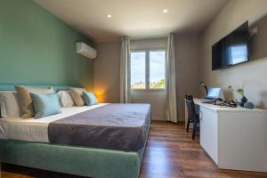 Voodi või voodid majutusasutuse Baitan Hotel toas
