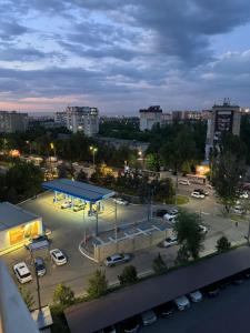 a view of a parking lot with a gas station at Quite apartment in Bishkek