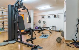 a room with a gym with several tread machines at 3 Bedroom Stunning Apartment In Calpe in Calpe +23 photos