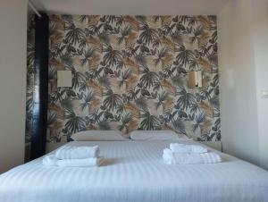 Voodi või voodid majutusasutuse Brit Hotel L'Arrivée Guingamp toas