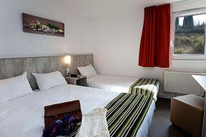 Postel nebo postele na pokoji v ubytování Brit Hotel Bosquet Carcassonne Cité + 28 fotografií