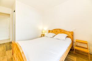 Posteľ alebo postele v izbe v ubytovaní Homency - Résidence de l'Alpe 19