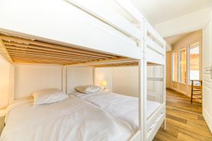 Posteľ alebo postele v izbe v ubytovaní Homency - Résidence de l'Alpe 19