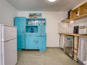 Kuchyň nebo kuchyňský kout v ubytování Holiday Home My Blue Wish by Interhome