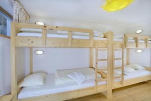 Posteľ alebo postele v izbe v ubytovaní Schöneben Abben Hütte + 26 fotografií