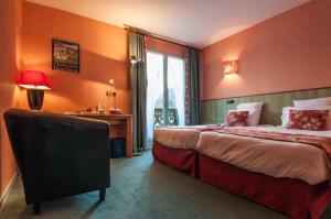 Postel nebo postele na pokoji v ubytování Brit Hotel Florimont
