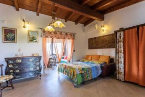 Postel nebo postele na pokoji v ubytování Villetta Isabella a Torre San Giovanni