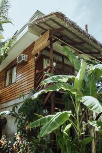 a wooden house with a pergola at Mango Tango Villas Siargao in General Luna +53 photos