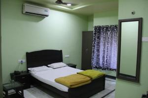 Katil atau katil-katil dalam bilik di Hotel Gujrat