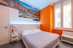 Postel nebo postele na pokoji v ubytování Hotel Fiume