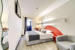 Postel nebo postele na pokoji v ubytování Brit Hotel Porte d'Espagne