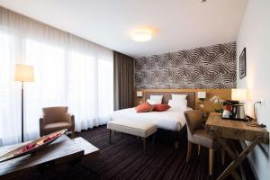 Postel nebo postele na pokoji v ubytování Le Lodge Brit Hotel Strasbourg Zenith + 37 fotografií