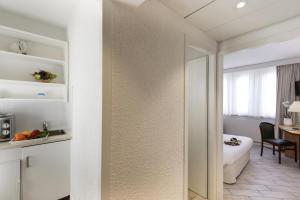 Postel nebo postele na pokoji v ubytování Résidence Studio Genève Centre