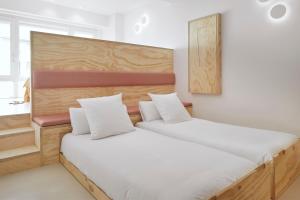 Ένα ή περισσότερα κρεβάτια σε δωμάτιο στο FeelFree STAYS Antiguo