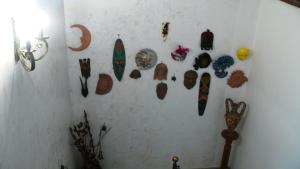 a wall with a bunch of items hanging on it at Sul Golfo in Formia
