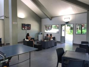 a group of people sitting in a waiting room at Anthares World Resort in Candia Canavese
