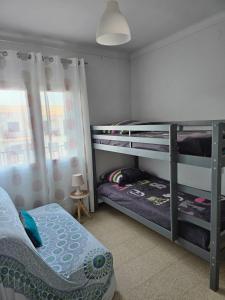 Posteľ alebo postele v izbe v ubytovaní Cosy apartment of l'Escala Beach
