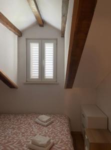 Кровать или кровати в номере Lanai Apartment