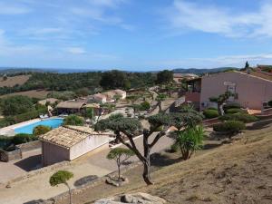 an aerial view of a house with a swimming pool at Domaine San Sebastiano in Porto-Vecchio +3 photos