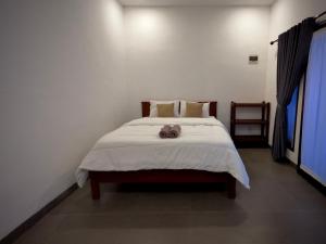 Kalamoana House客房内的一张或多张床位