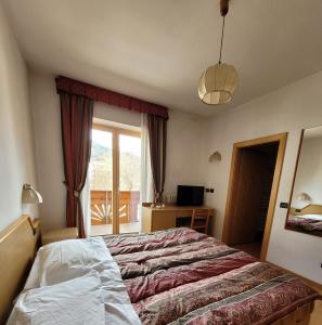 Postel nebo postele na pokoji v ubytování Garni B&B Mozart Nesthouse