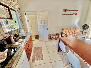 Η κουζίνα ή μικρή κουζίνα στο Apartamentos Recanto da Barra +22 φωτογραφίες