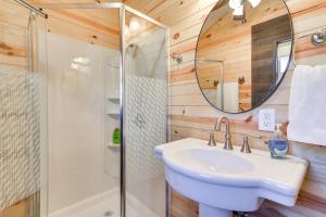 a bathroom with a sink and a shower at Ranch Cabin with Decks, 10 Mi to Fredericksburg in Fredericksburg
