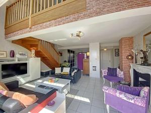 a living room filled with furniture and a staircase at RÉF 353 appartement duplex Lorient centre in Lorient