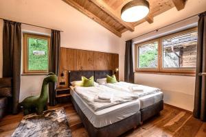 Katil atau katil-katil dalam bilik di Nationalpark Chalet Alplesspitze