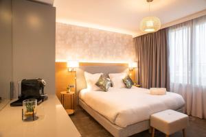 Postel nebo postele na pokoji v ubytování Brit Hotel Paris Orly Rungis