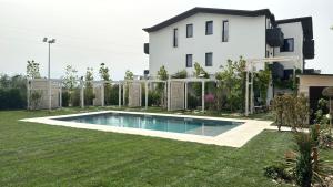 a house with a swimming pool in the yard at RESIDENCE MARCO POLO in Montesilvano