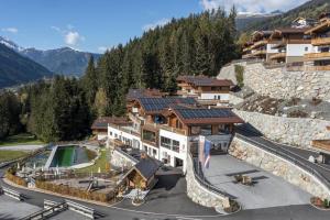 an aerial view of a building on a mountain at Nationalpark Chalet Blindis in Neukirchen am Großvenediger