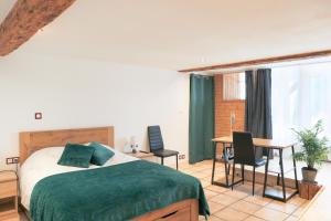 Postel nebo postele na pokoji v ubytování Relais des Salines