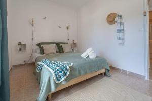 Postelja oz. postelje v sobi nastanitve Loft des Crêtes vue mer