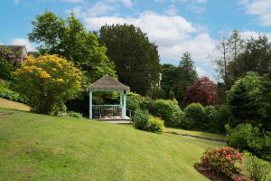 a gazebo in the middle of a yard at The Lakehouse Rooms at The Waterhead Inn, Ambleside in Ambleside